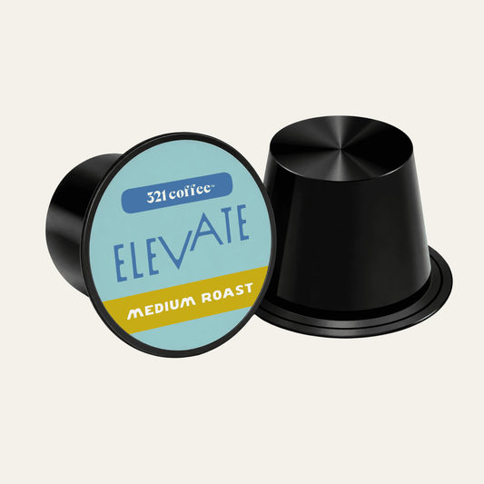 Coffee pod with the coffee name "Elevate" on a teal background of a black pod.
