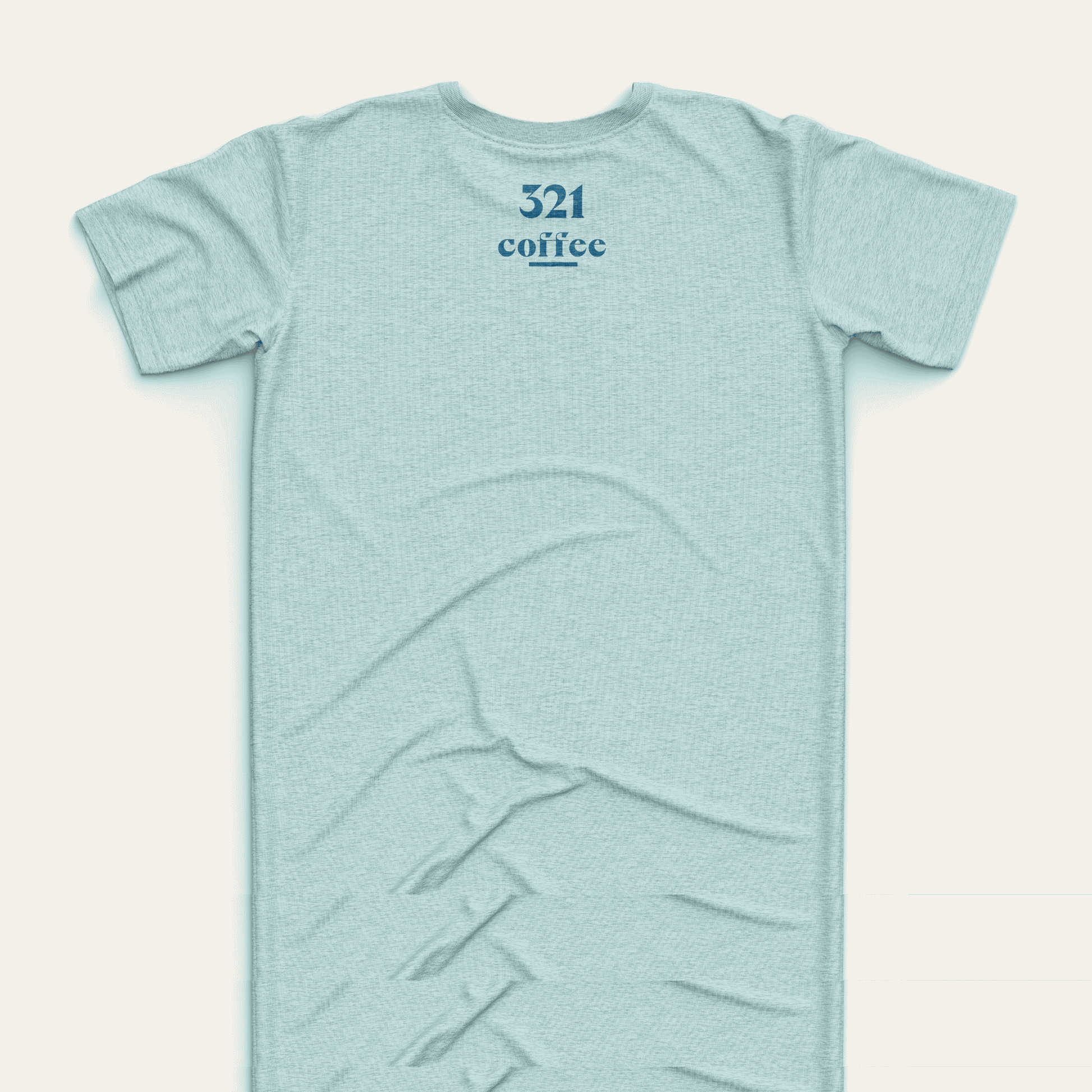 The back of a teal t-shirt showing "321 "Coffee" in blue located at the top of the shirt just under the collar.