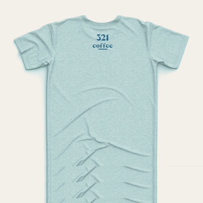 The back of a teal t-shirt showing "321 "Coffee" in blue located at the top of the shirt just under the collar.