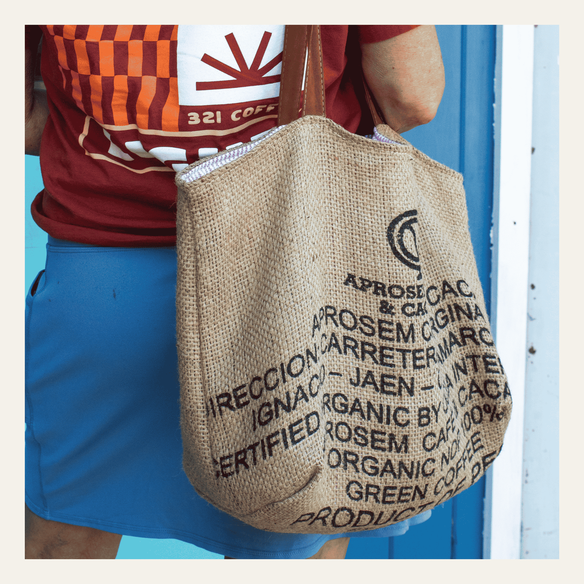 A single tote bag made from coffee burlap is shown over the shoulder of a user.