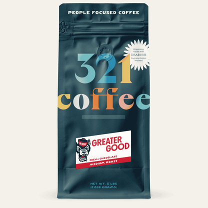 A navy blue bag with "321 Coffee" written in colorful letters. Below that, the blend name, Greater Good, is written on a white background.