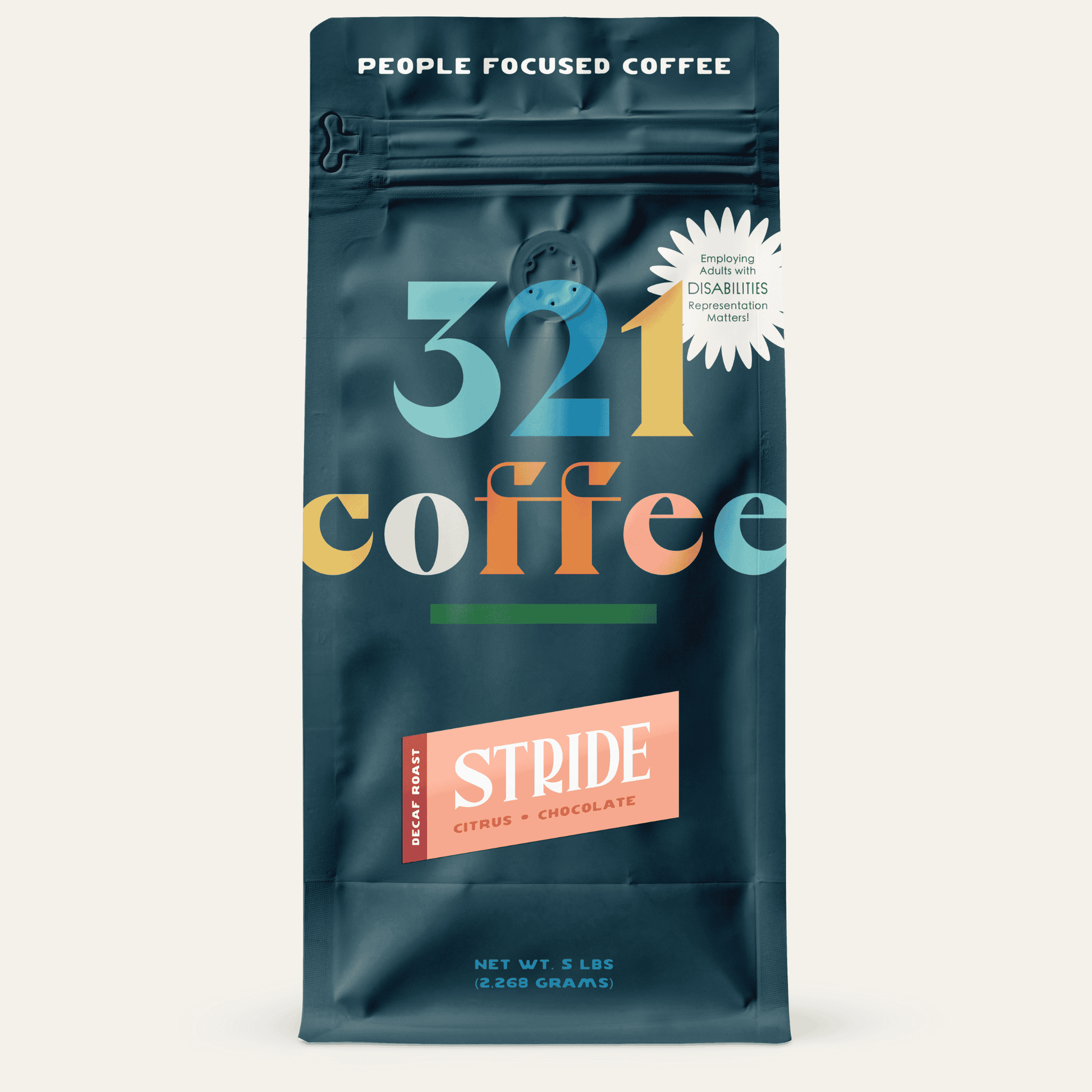 A navy blue bag with "321 Coffee" written in colorful letters. Below that, the blend name, Stride, is written on a pink background.