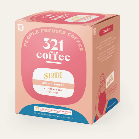 A 3D box of 321 Coffee's Stride coffee pods. The box is pink with elements of 321 Coffee's branding.