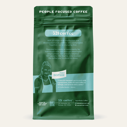 Back view of 321 Coffee’s Uplift coffee bag. The back of the bag is green and contains information about the company and a quote from 321 Coffee roaster and barista, Sophie.