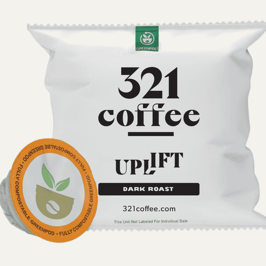 Uplift coffee pod packaging wrapper shown with a compostable coffee pod out of the wrapper. 
